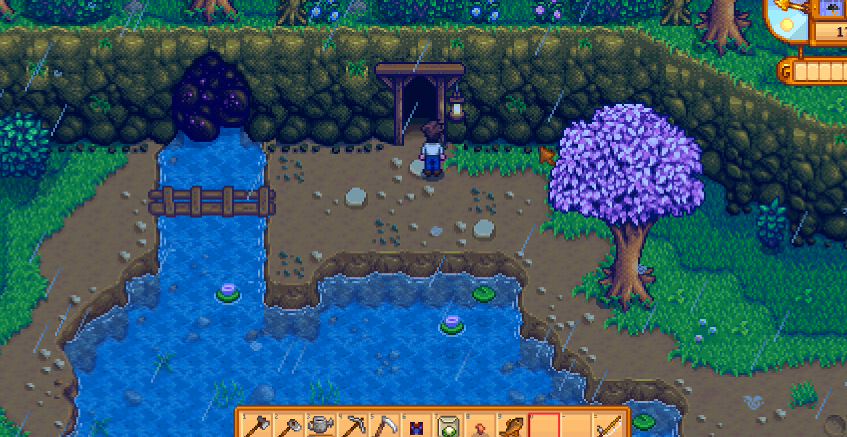 Stardew Valley Year 1 Mines entrance on a rainy day for ore farming