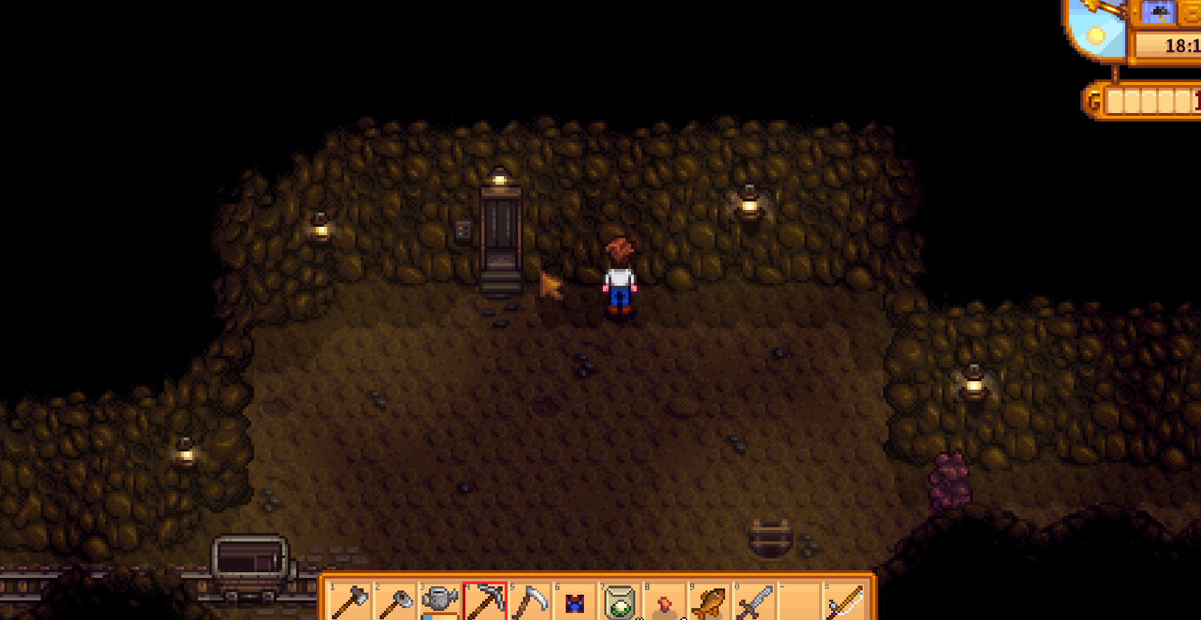 Stardew Valley mine interior with elevator door and pickaxe selected